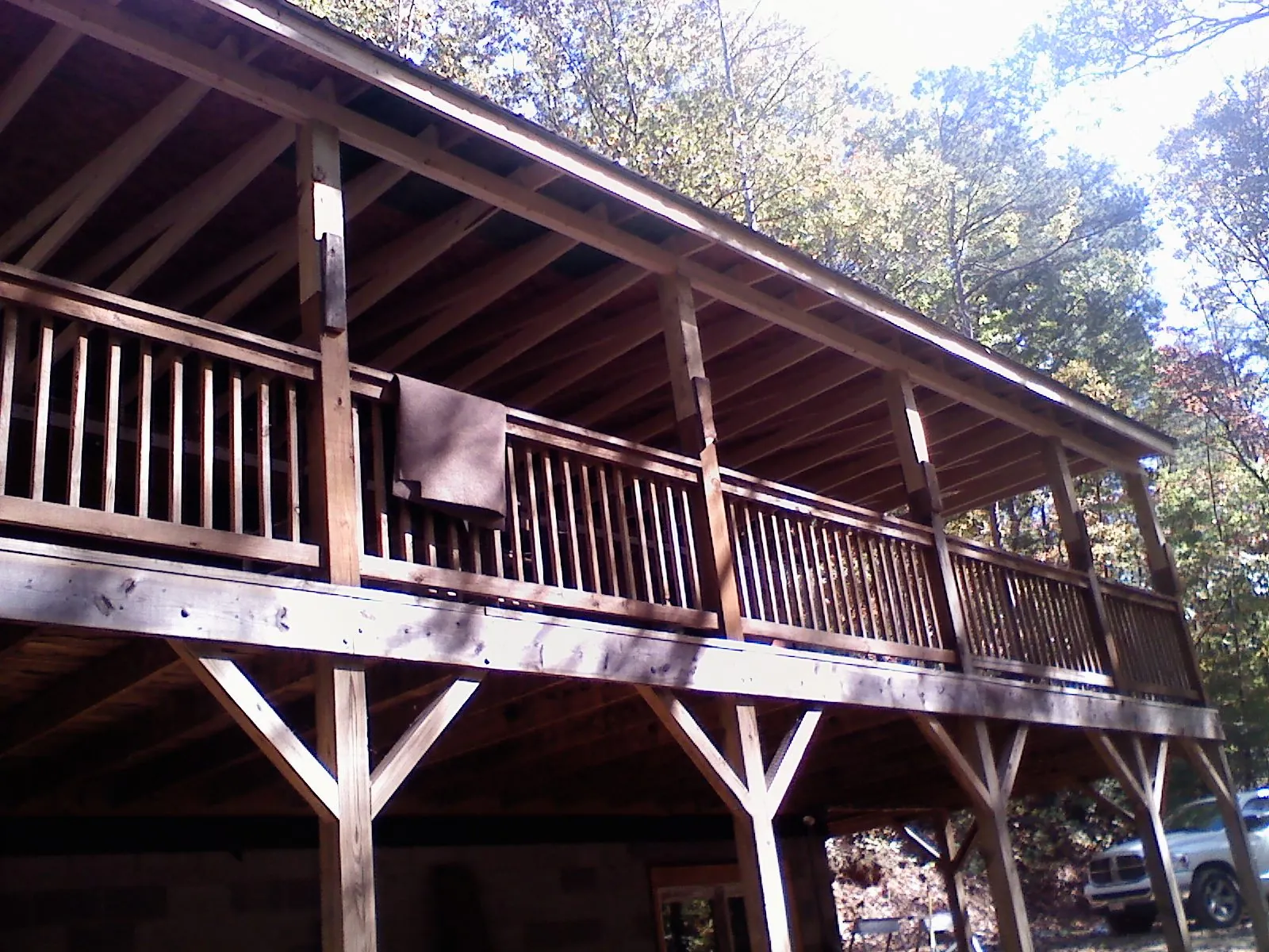 Timber framing under a new elevated porch and deck — Roof Leak Repair in Madison Heights by Roofing Brothers